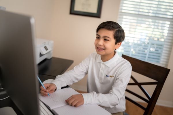 Boy engaged with online class